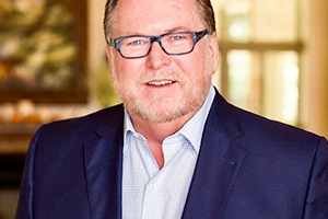 Steve Dixon Smiling Headshot in a Suit Three