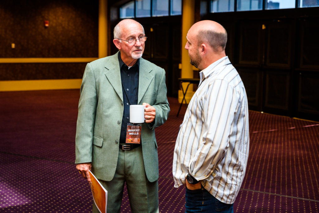 Two Men Talking to One Another